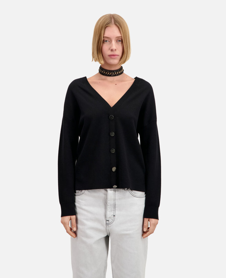 ecru sweater with buttoning on the back