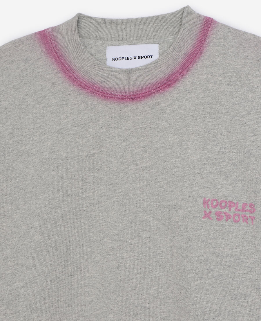 grey sweatshirt with pink details and fading