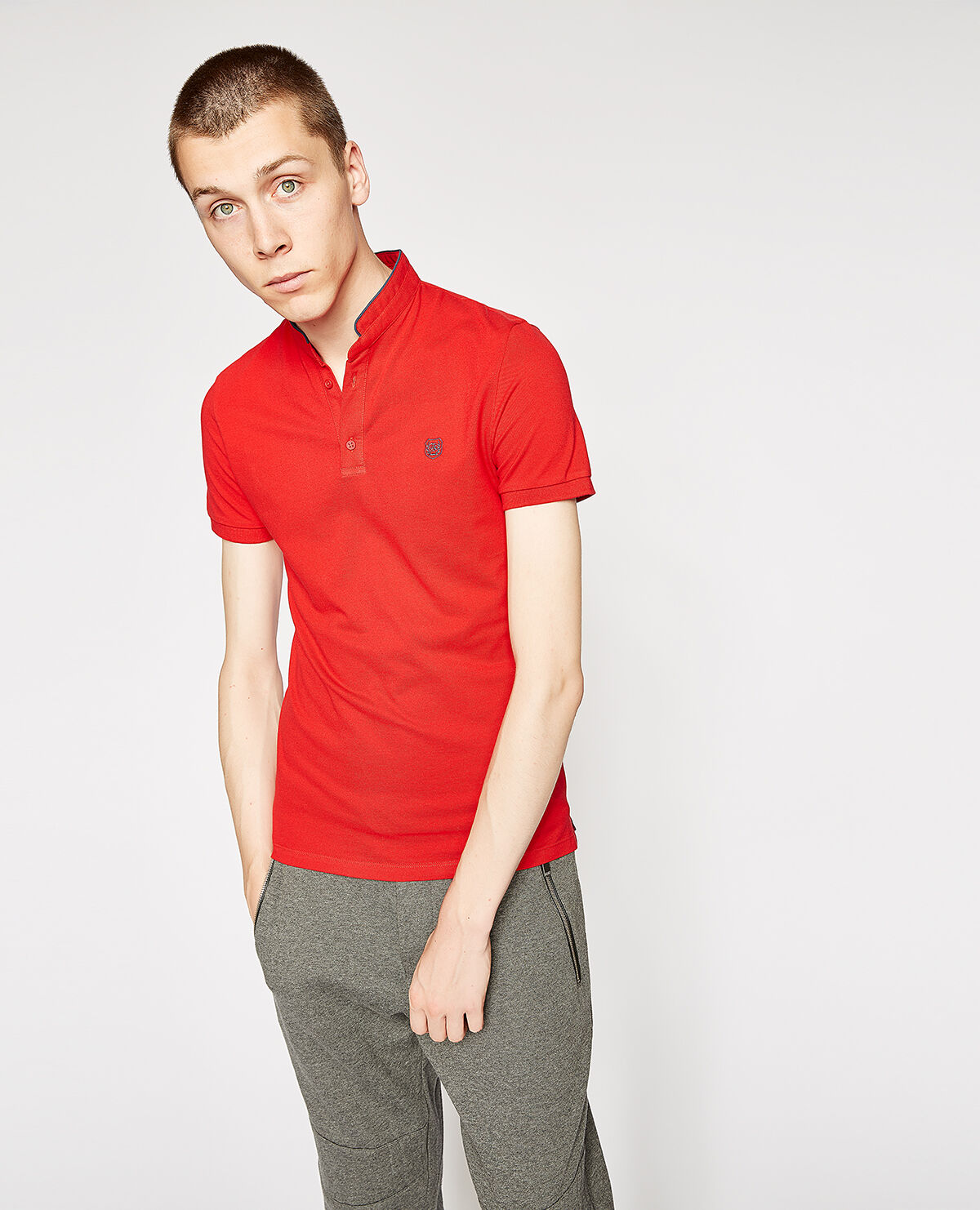 Bright red polo shirt with an officer collar and ocean blue details