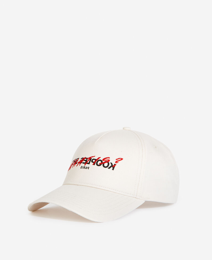 white cotton cap with embroidered “what is”