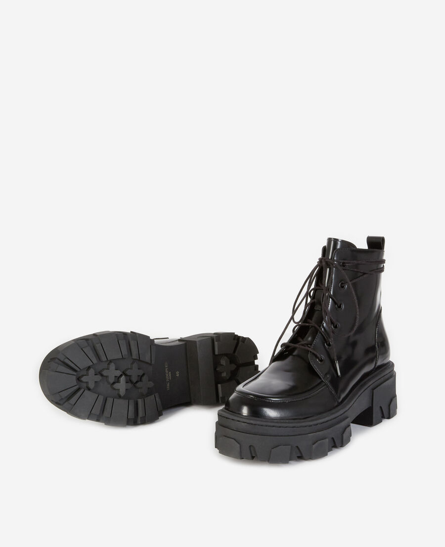 black leather ankle boots with notched sole