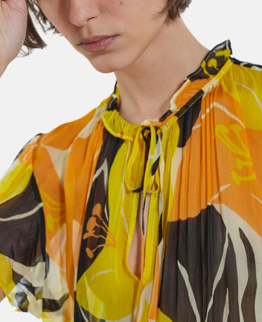 flowing yellow printed top with frills
