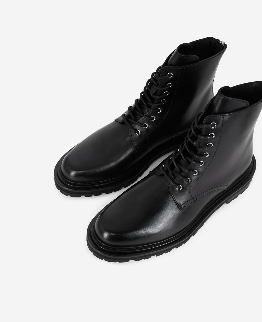 boots en cuir noir à semelle épaisse