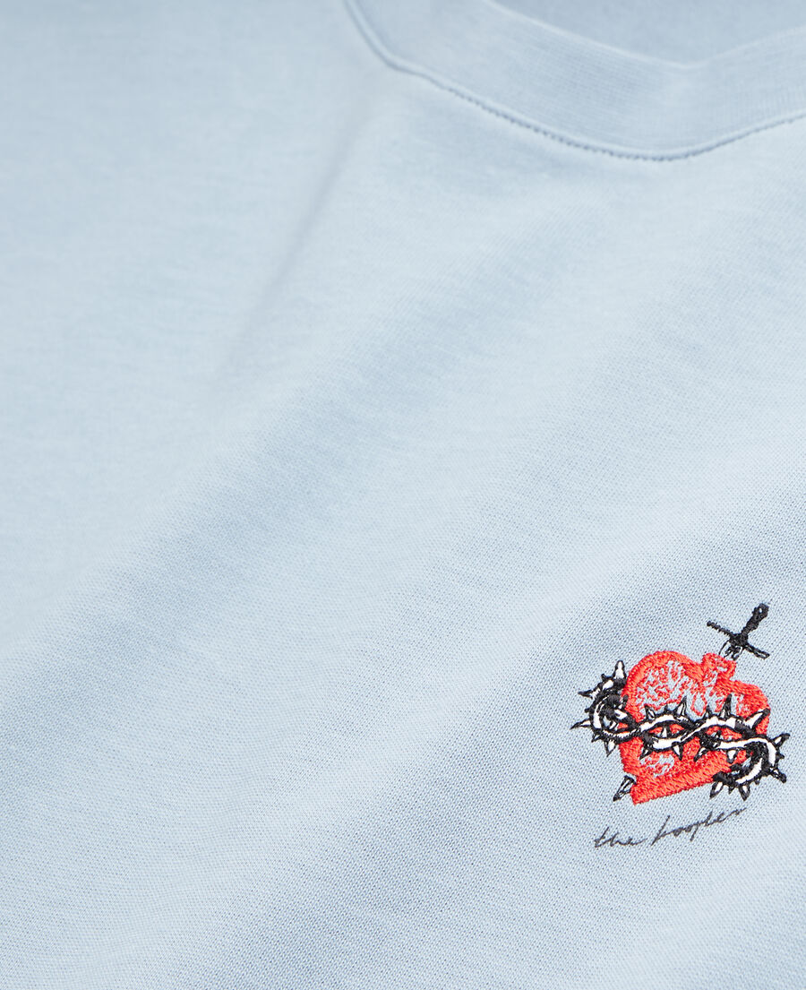 blue t-shirt with dagger through heart embroidery