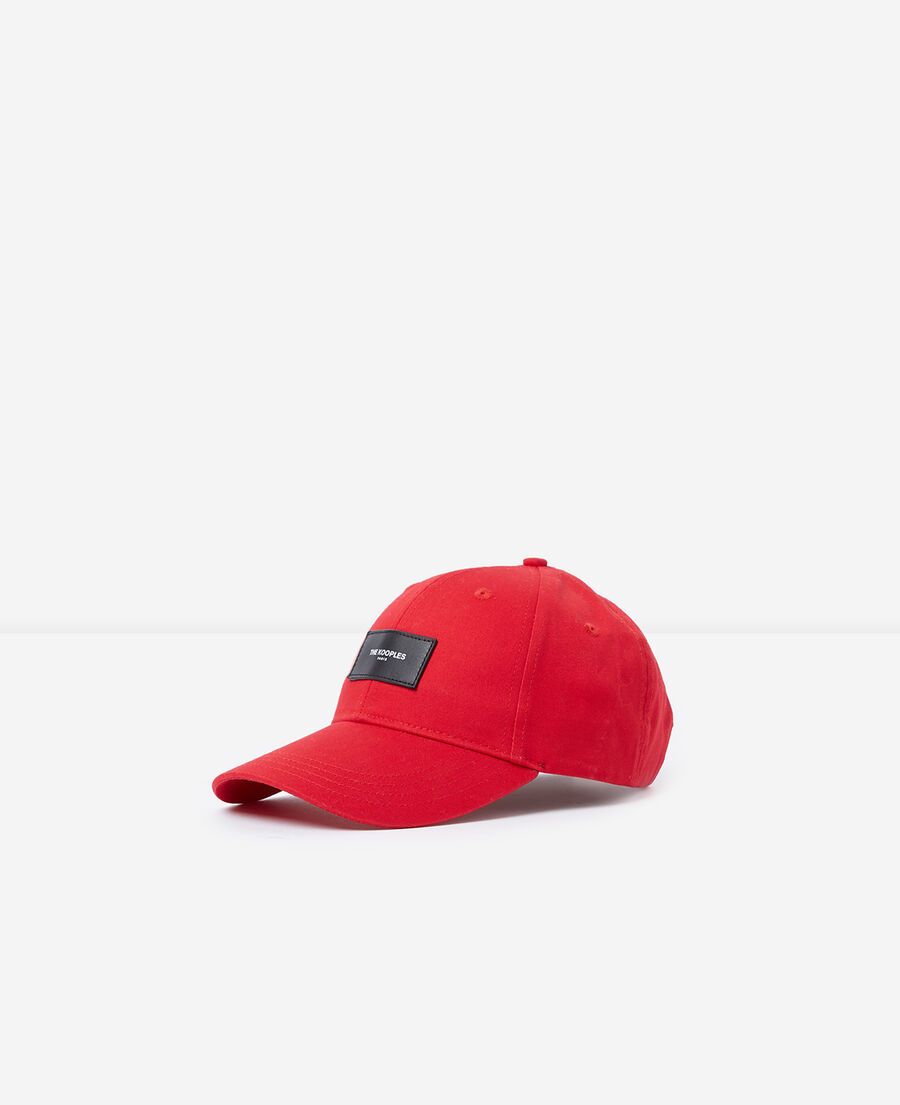 red cap with patch and logo