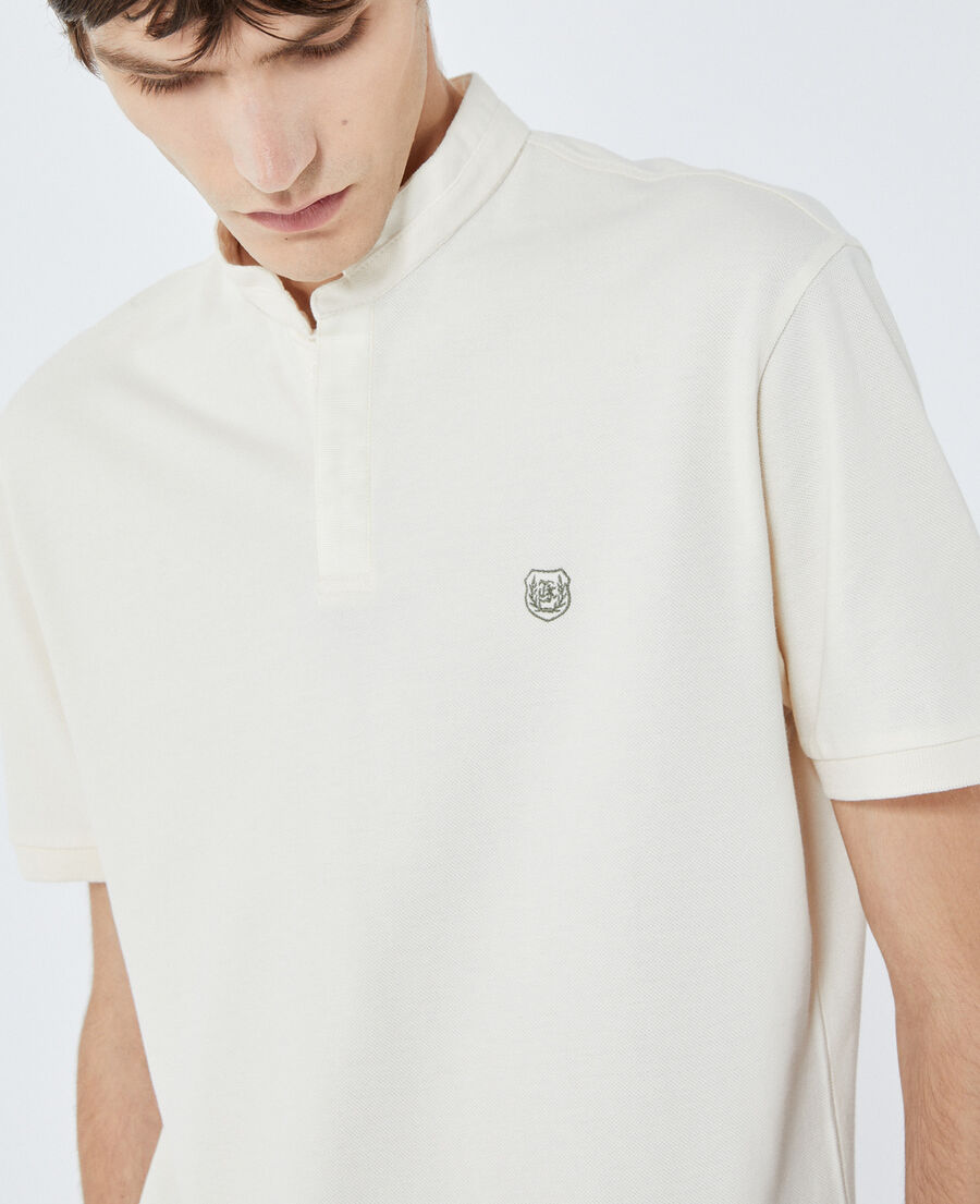white cotton polo with green piping