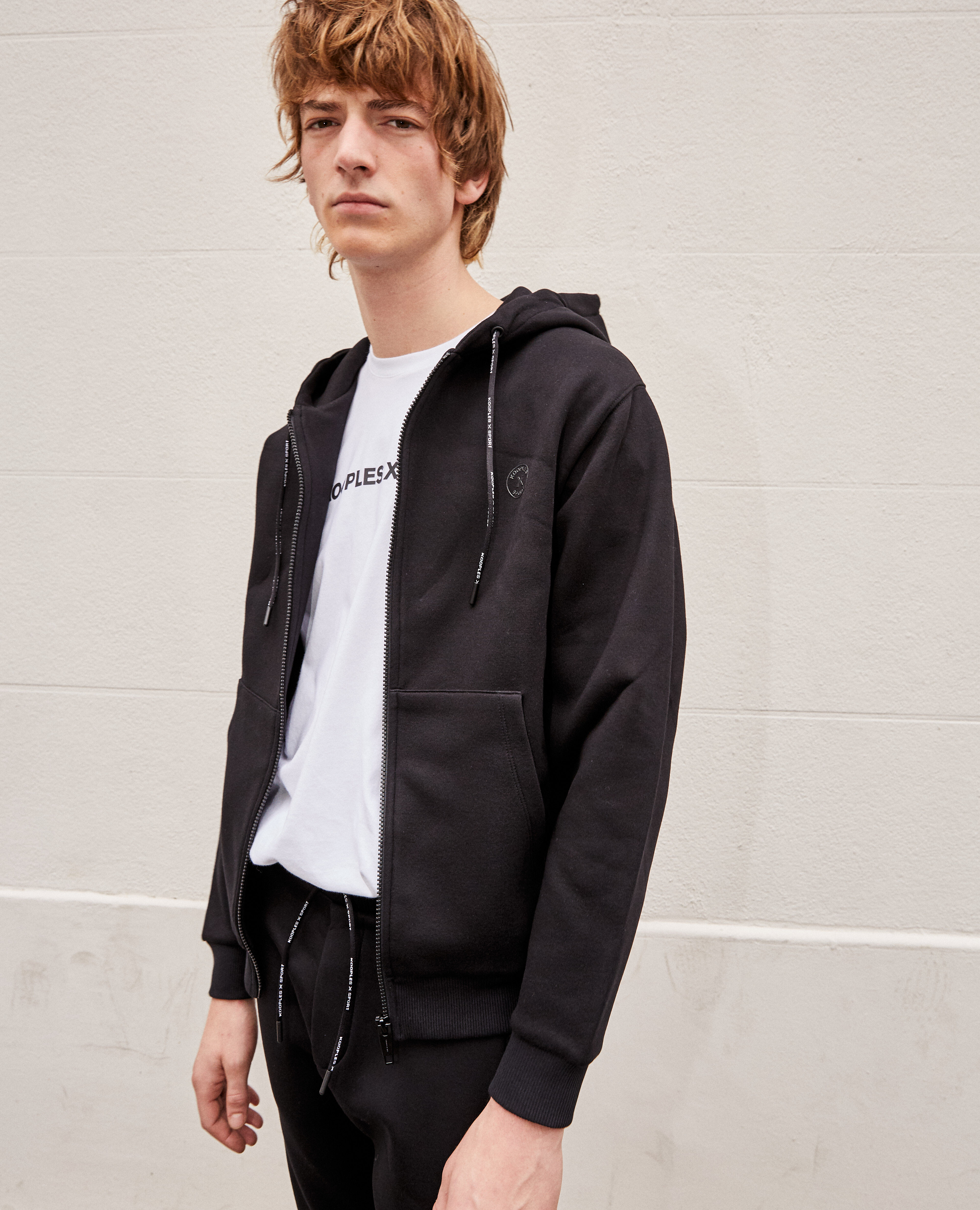 Black sportswear jacket pouch pocket