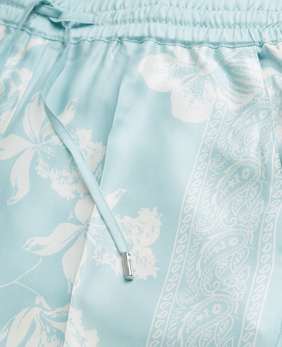 flowing blue and white pants with scarf motif