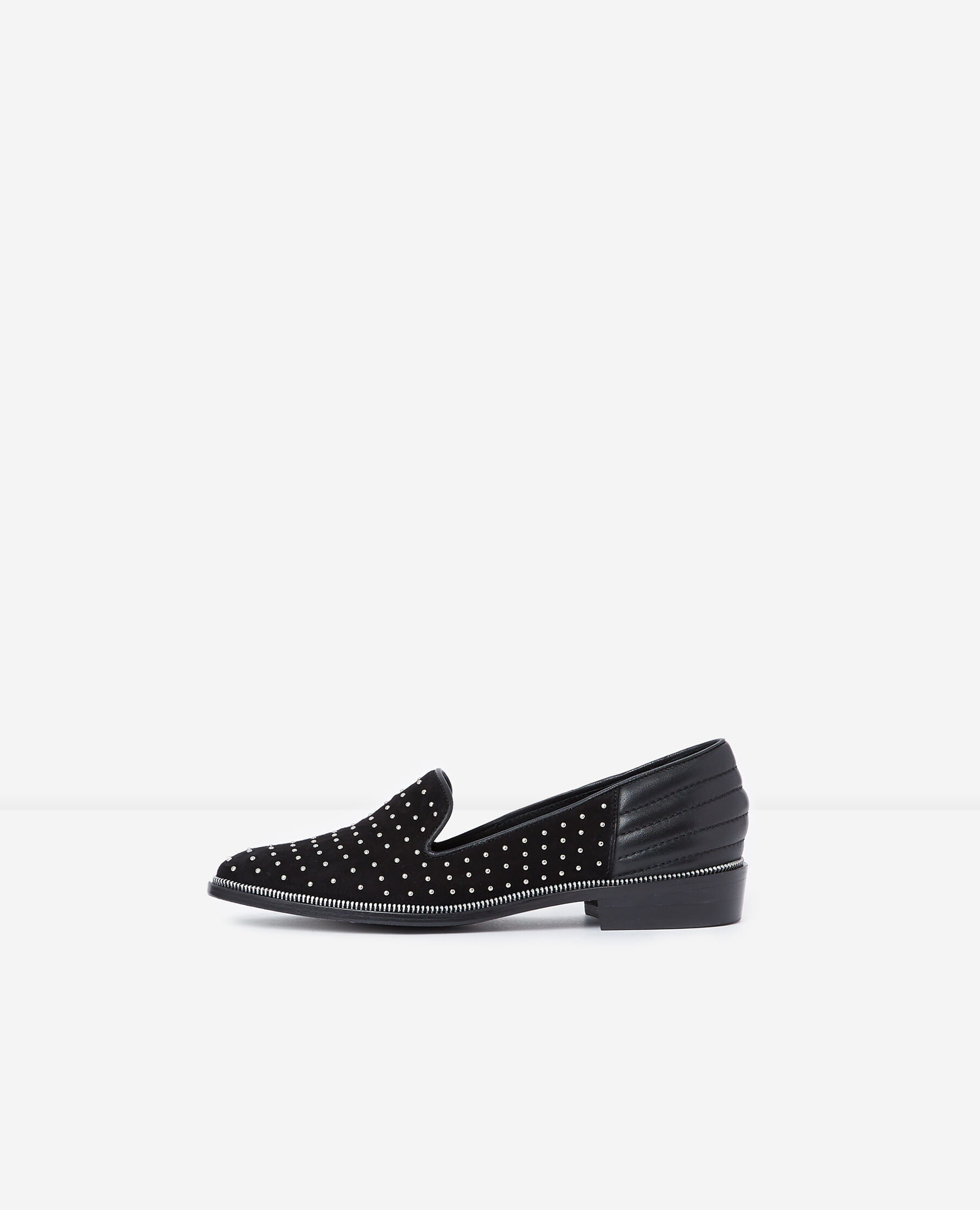 Leather slippers decorated with studs