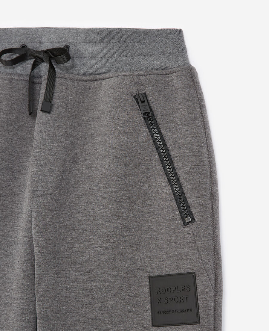 zipped grey joggers with trims and logo