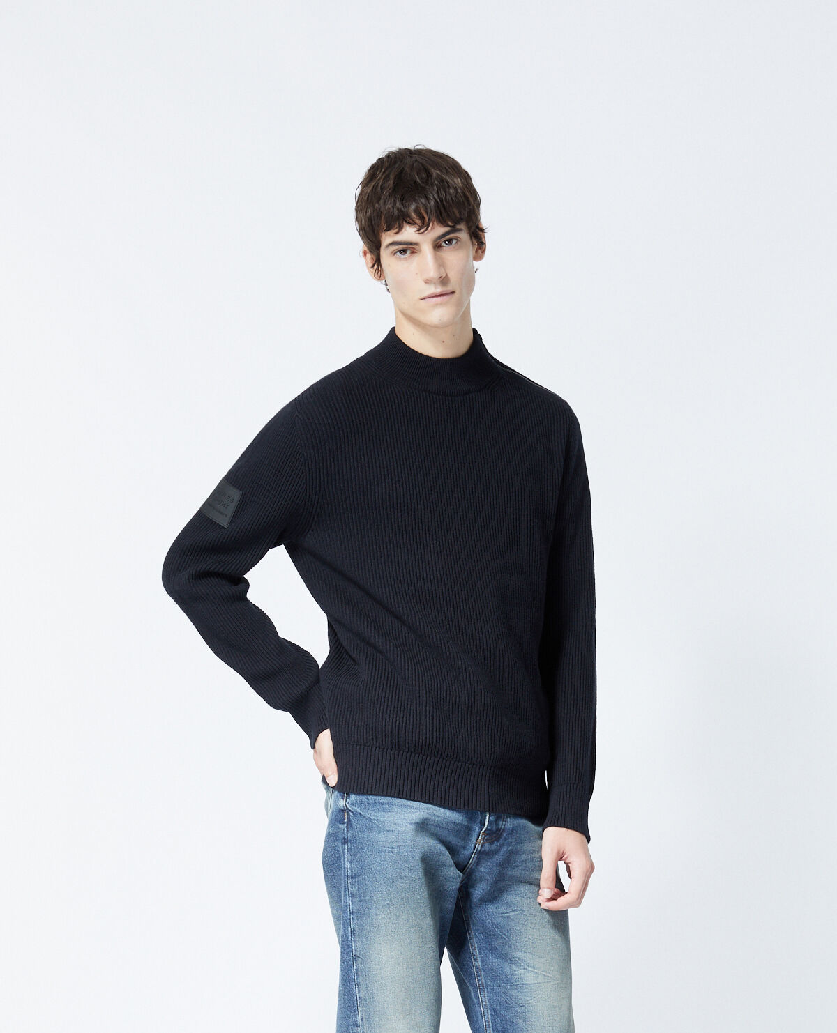 Black wool sweater with zipped high neck