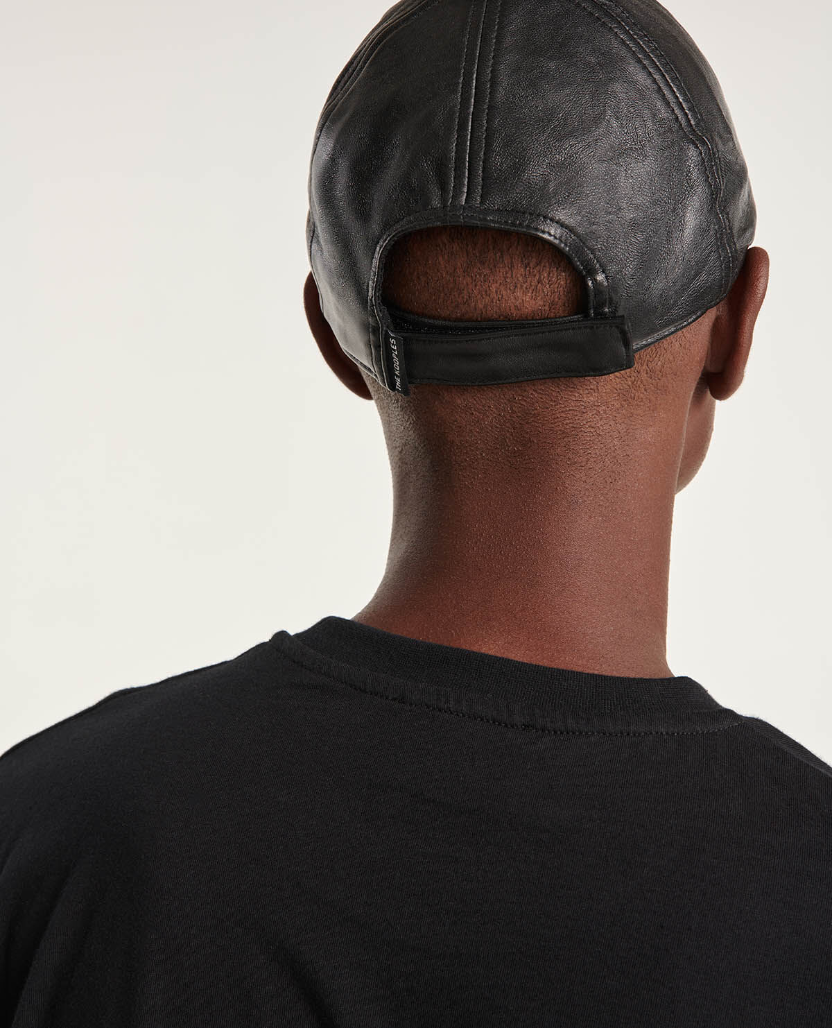 Black leather cap with skull detail