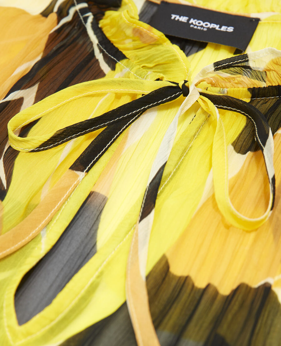 flowing yellow printed top with frills