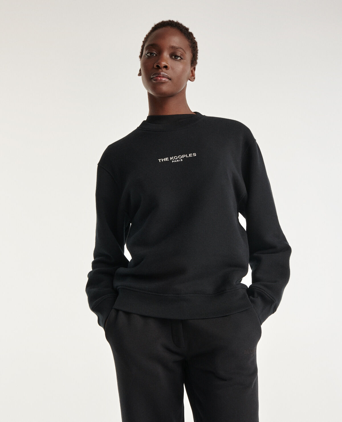 Black sweatshirt with silver relief logo