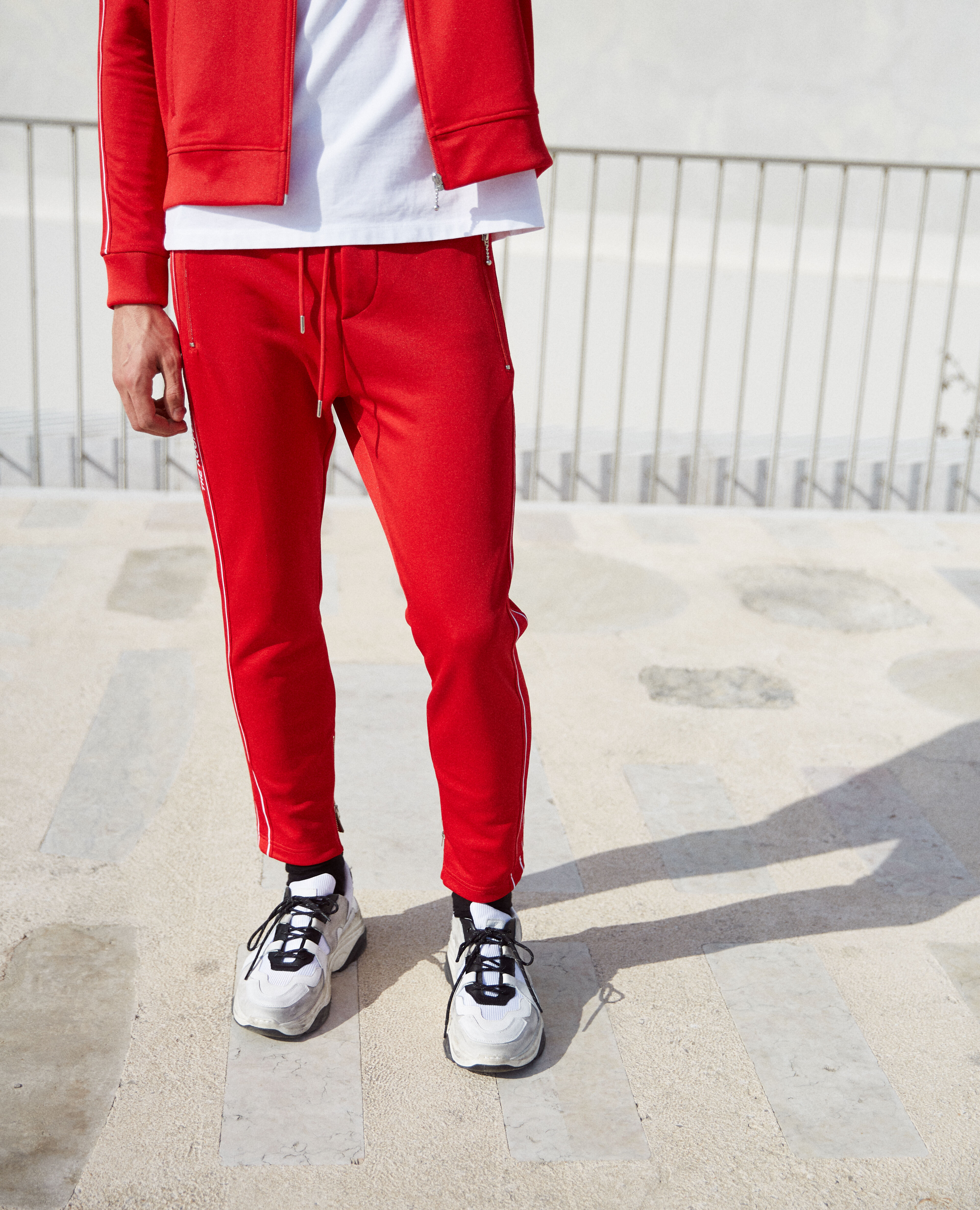 Skinny red joggers with red band logo and zip The Kooples
