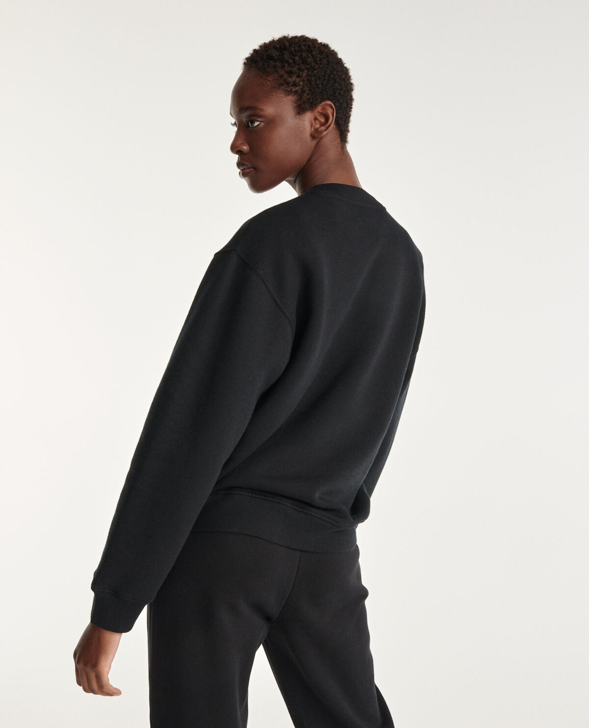 Black sweatshirt with silver relief logo