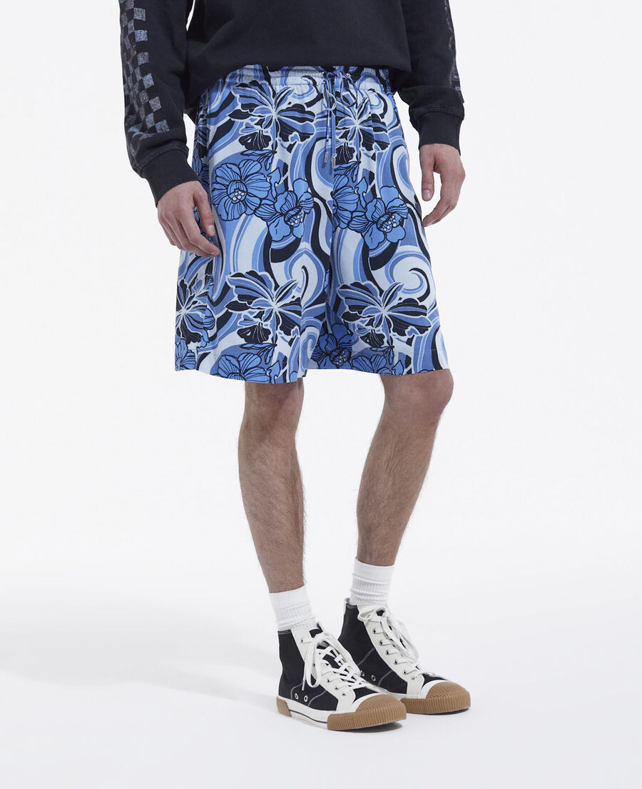 flowing blue shorts with psychedelic print
