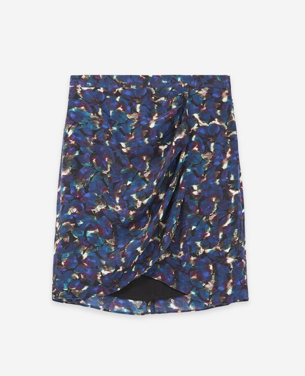 Short blue flowing skirt with floral motif