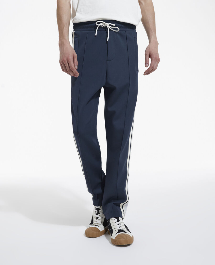 navy blue loose-fit joggers with ecru bands