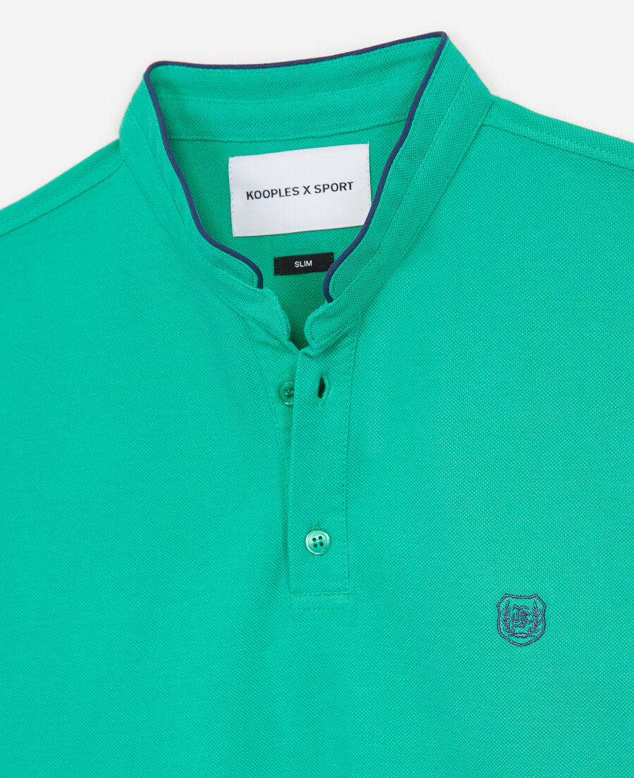 green cotton polo with blue badge