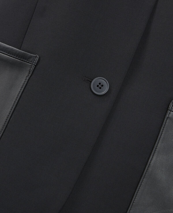 fitted black wool jacket with leather pockets