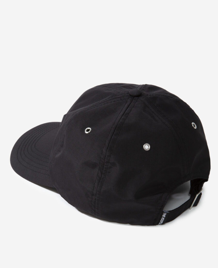 black nylon cap with matching leather badge