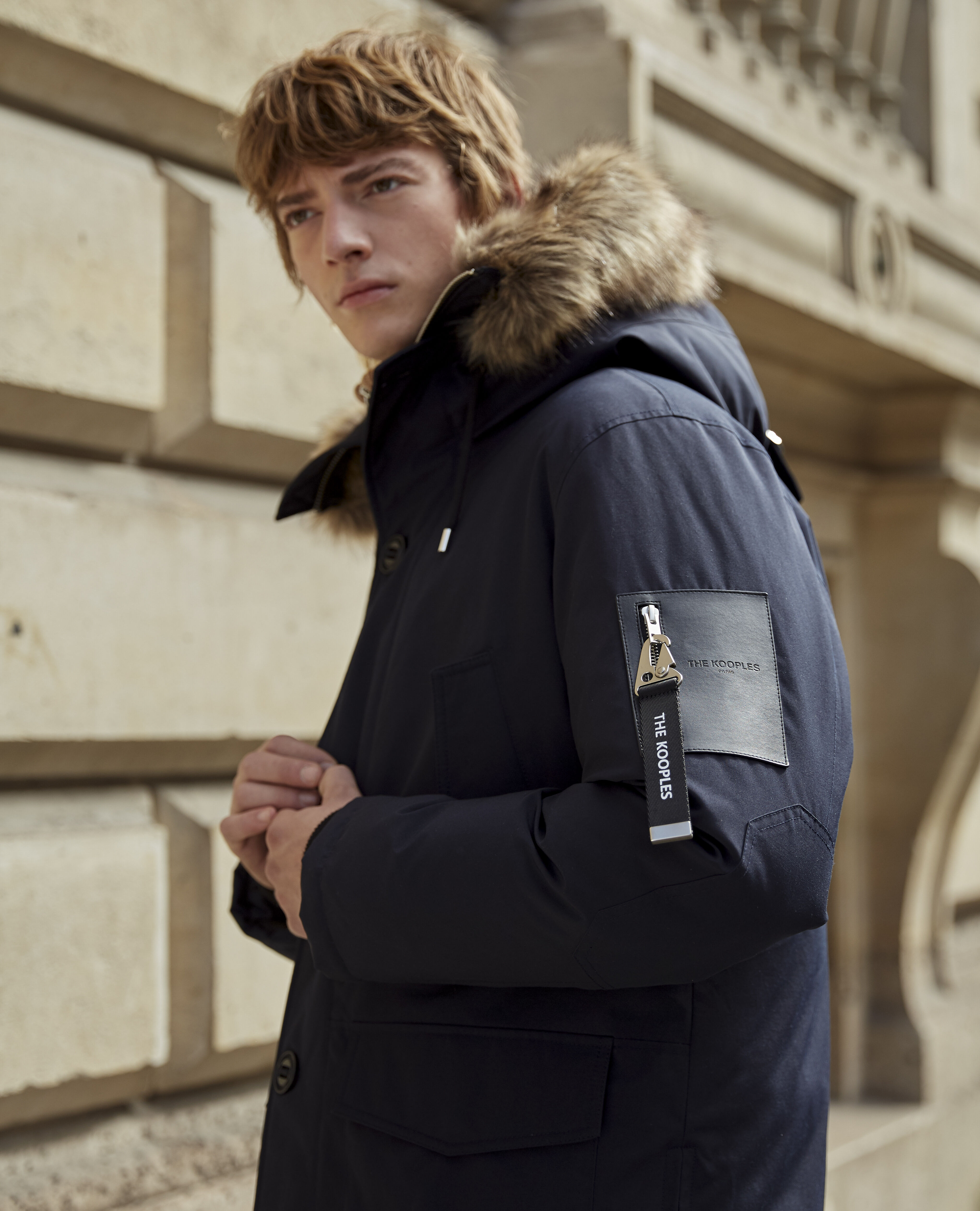 Blue parka with faux fur hood