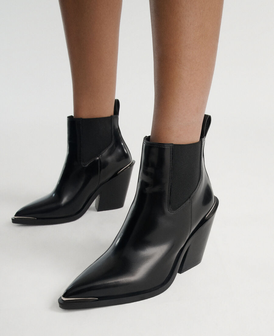 glossy black leather boots in western style