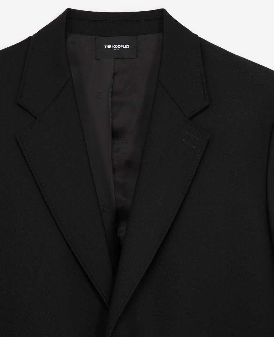 black jacket with covered buttons