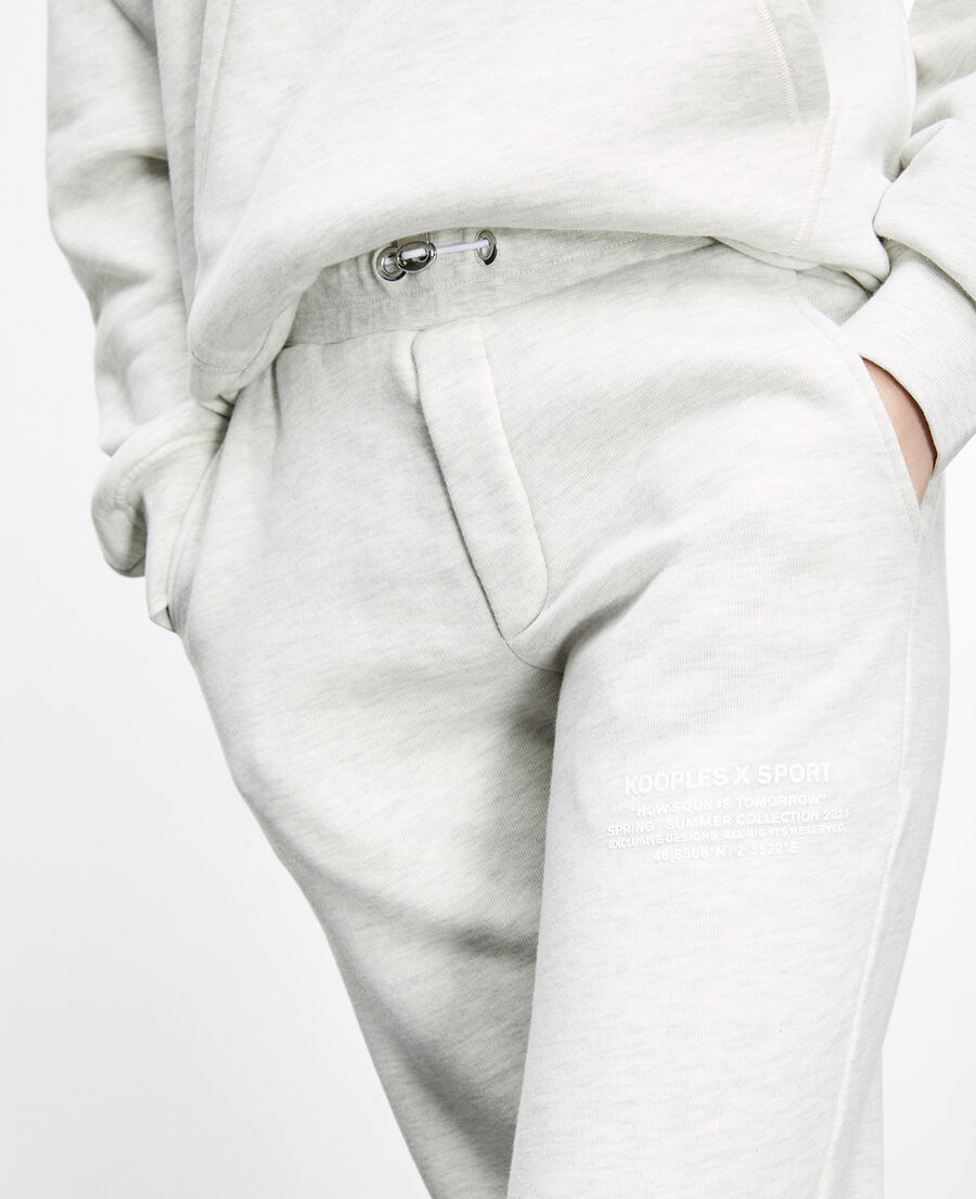 gray joggers with rubber logo