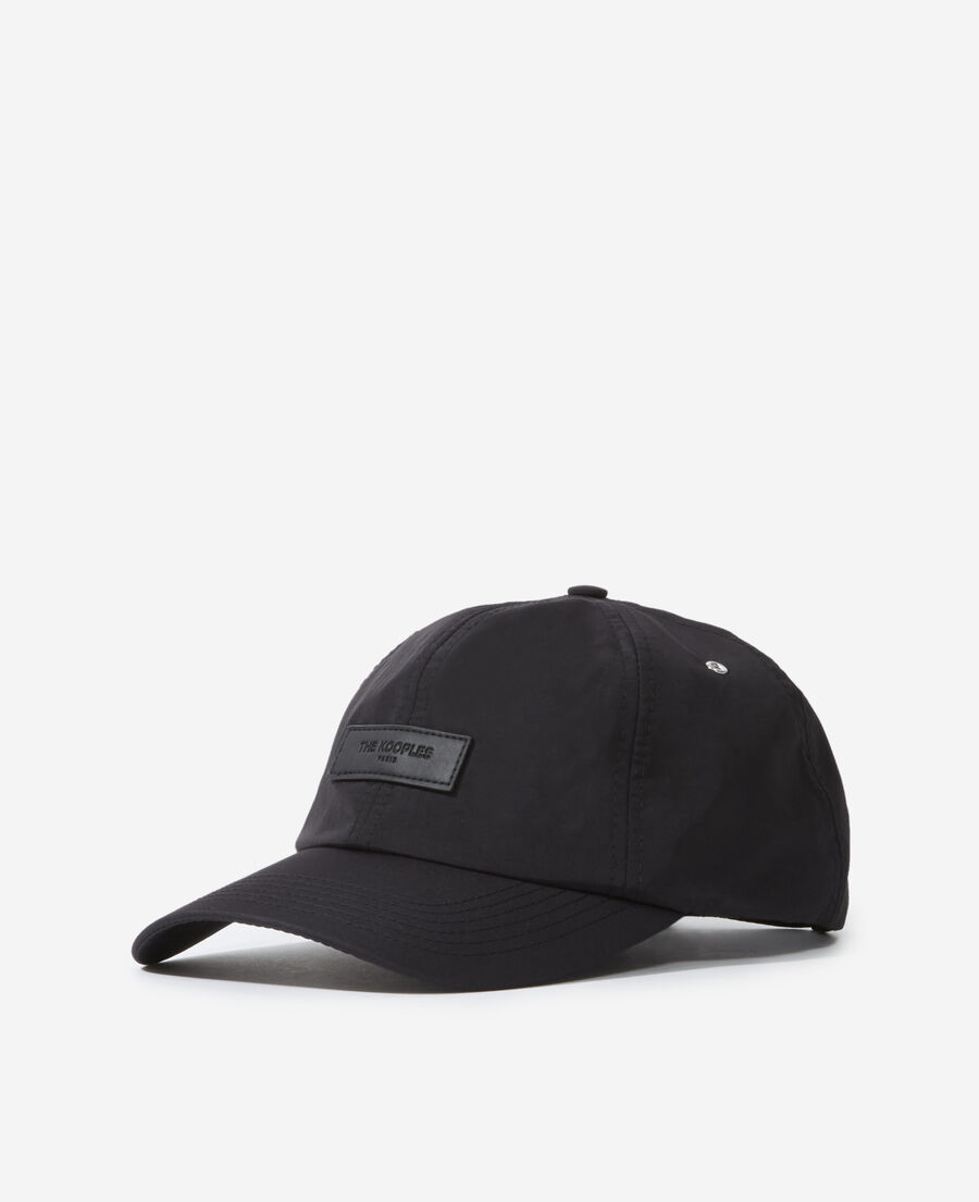 black nylon cap with matching leather badge