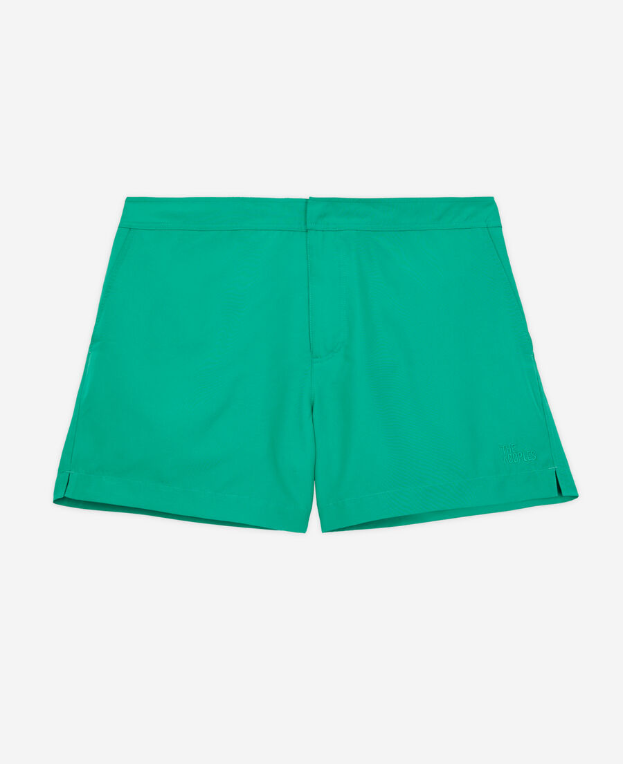 grüne badeshorts mit logo