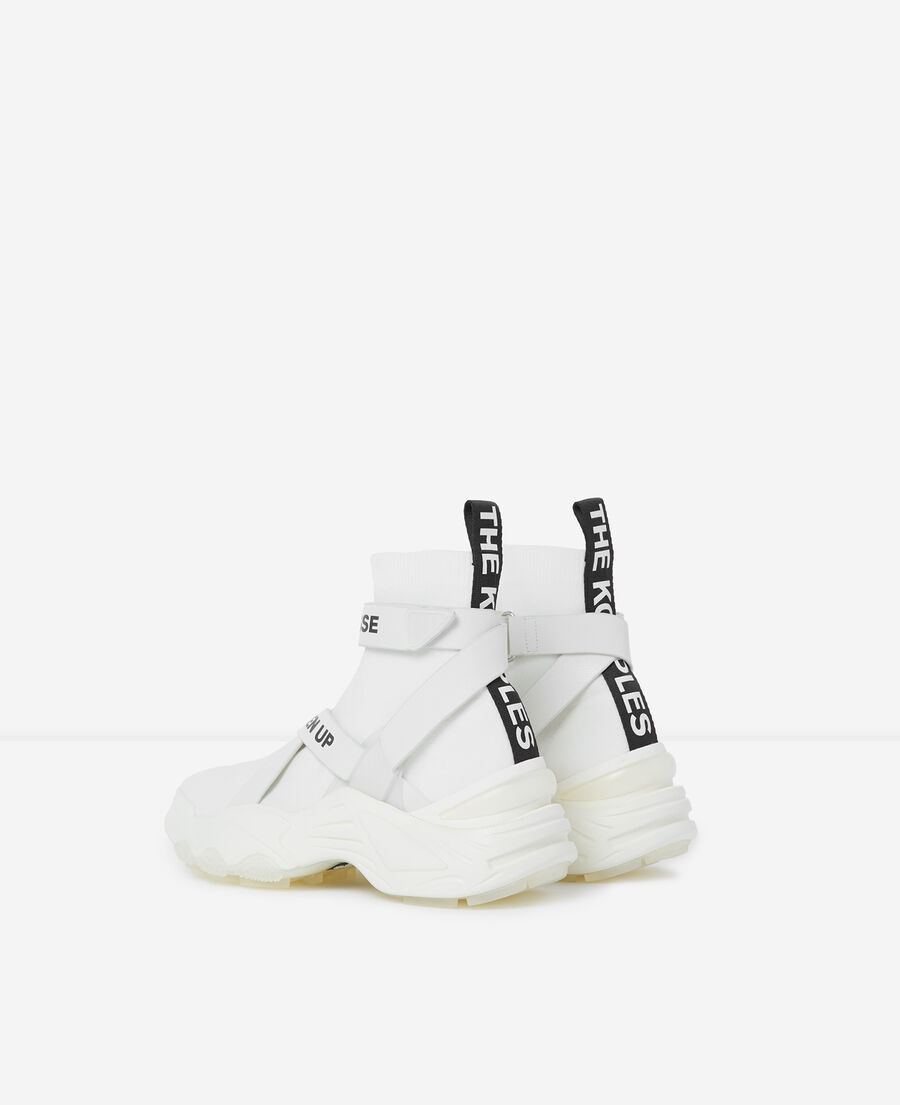 slick white high-top trainers with text