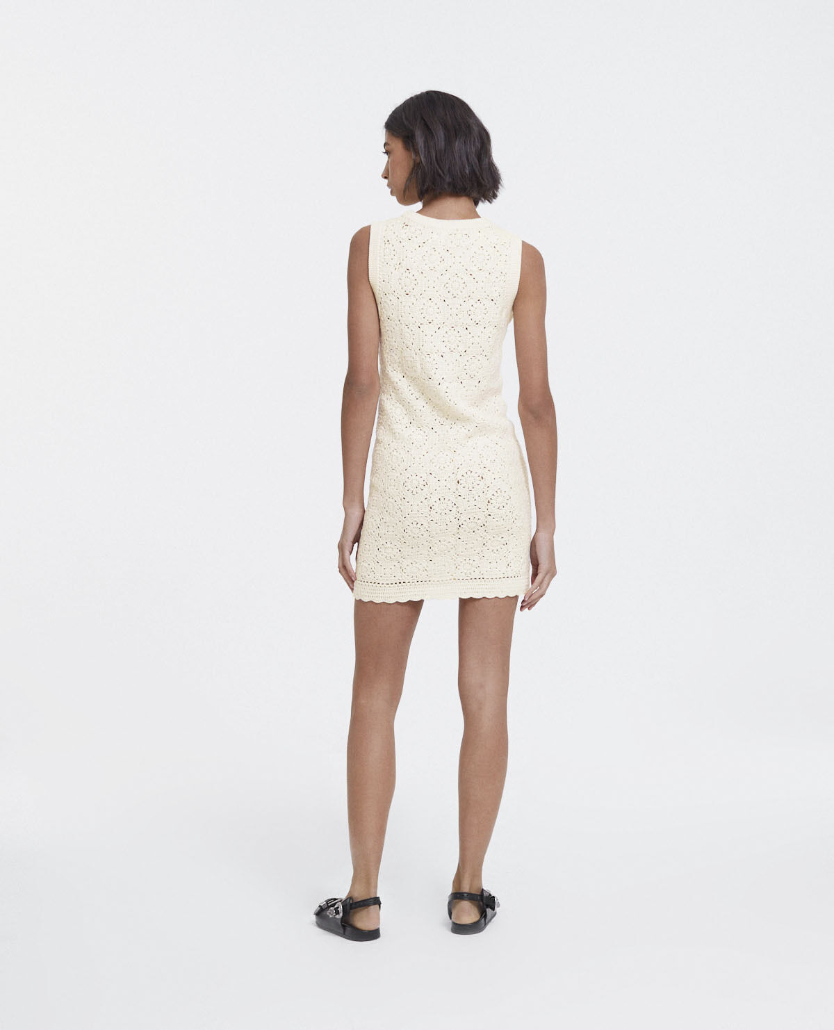 Short sleeveless white cotton dress