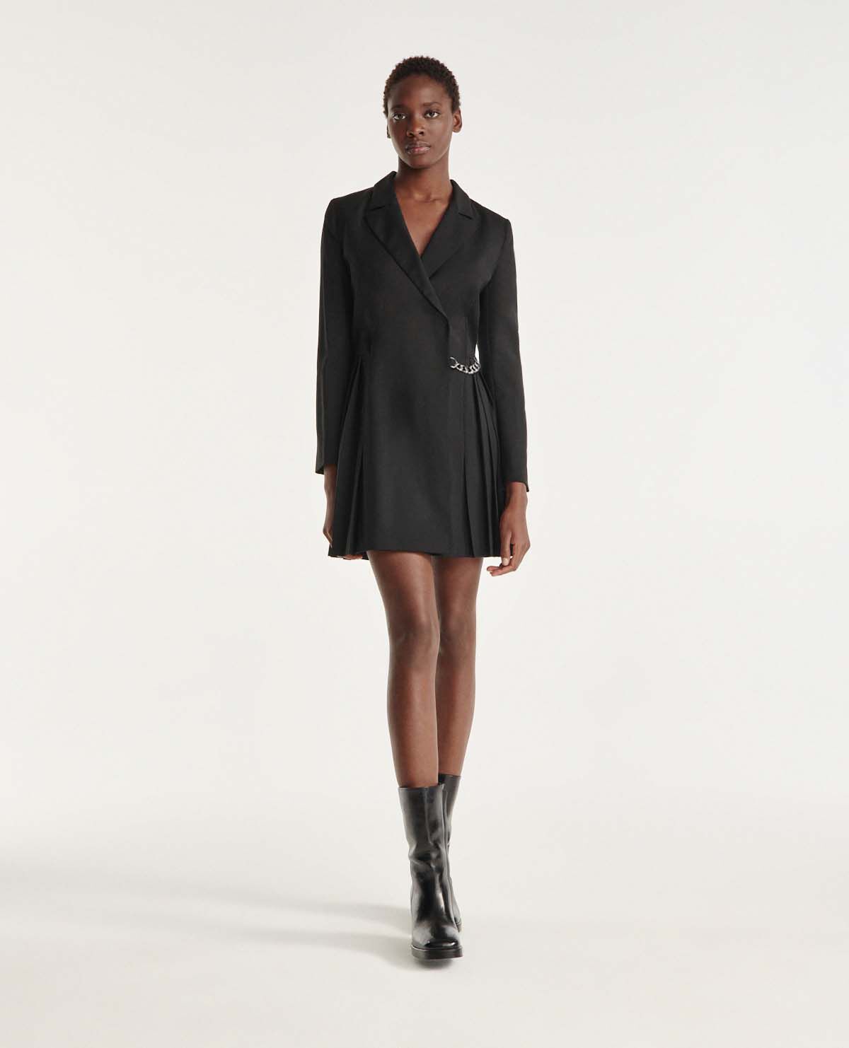 Short black wrap dress with pleat chain