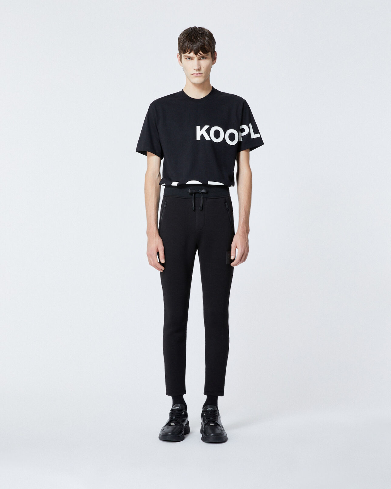 The Kooples MEN BLACK zipped skinny black joggers with logo patch