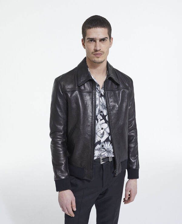 Leather jacket with leopard print lining
