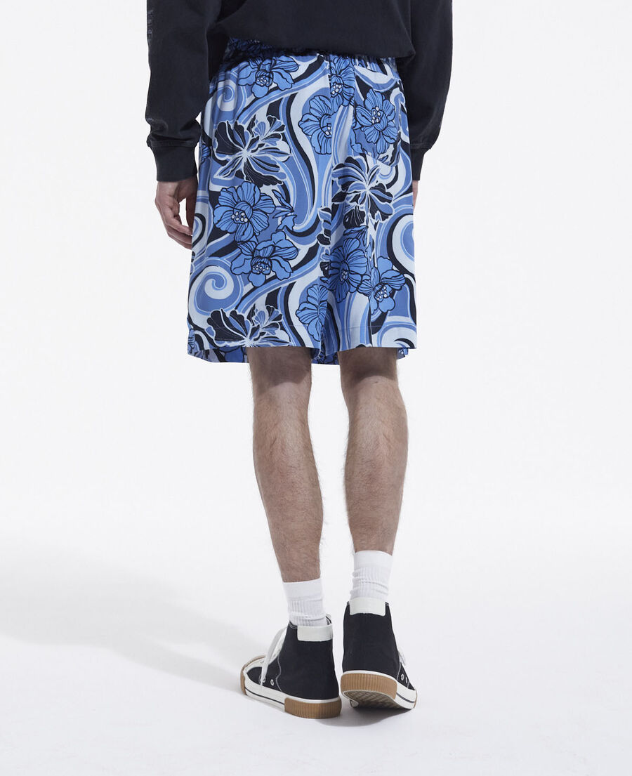 flowing blue shorts with psychedelic print