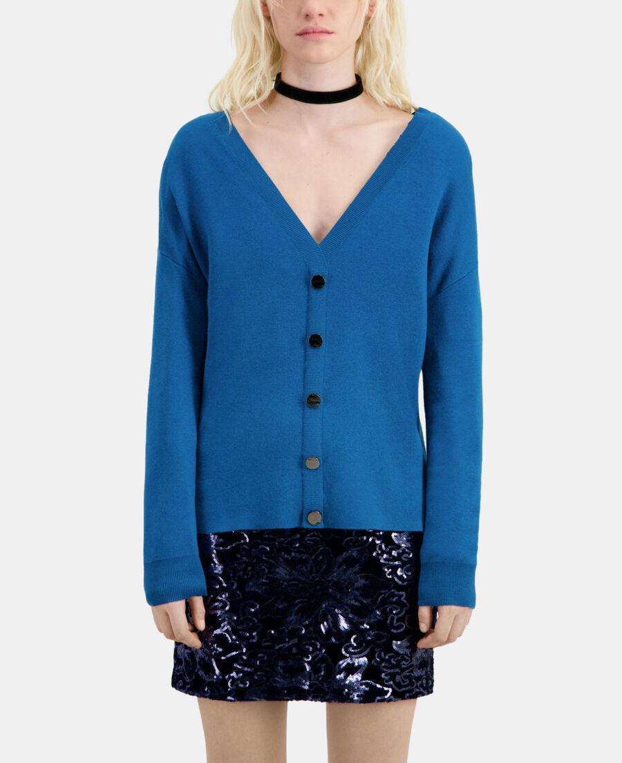 blue sweater with buttoning on the back
