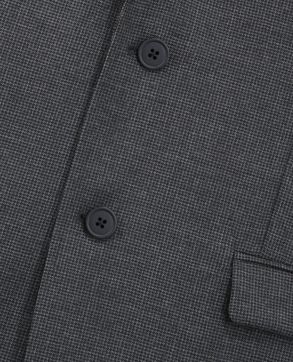 black and gray jacket with micro check motif