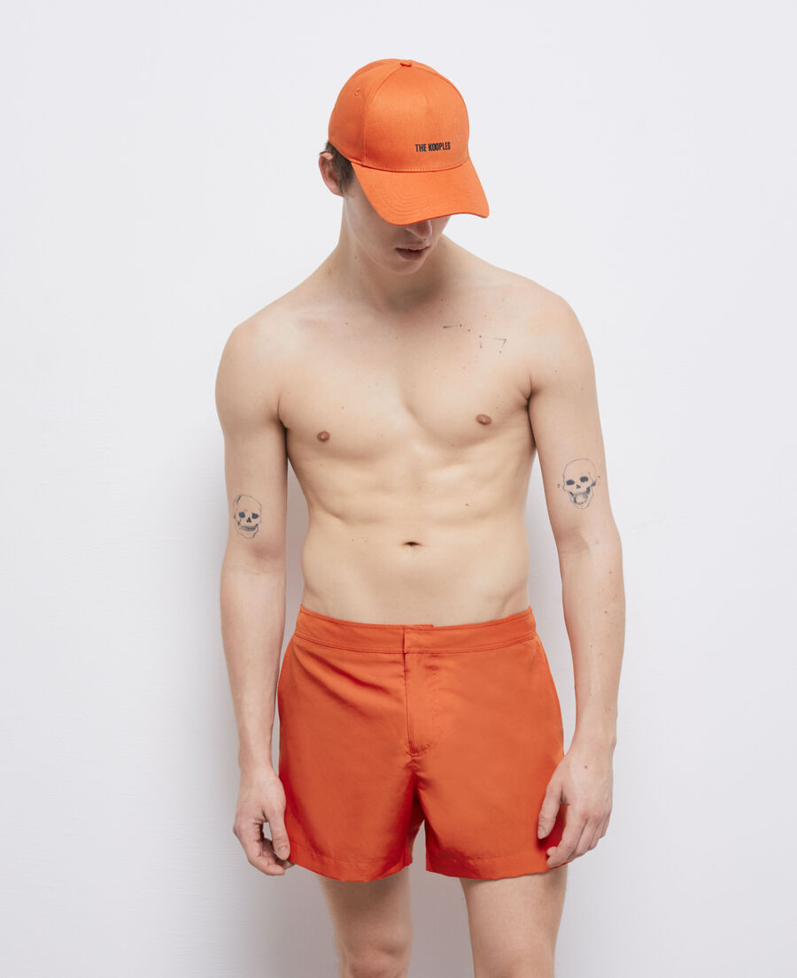 orange swim shorts with logo