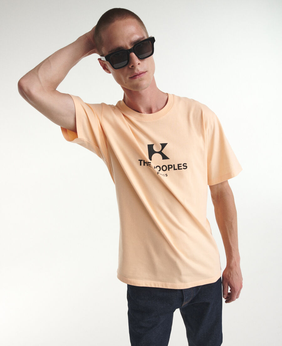 coral-orange cotton t-shirt with 'k' monogram