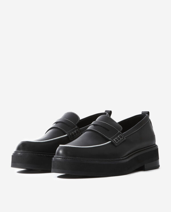 black leather moccasins with contrast trims