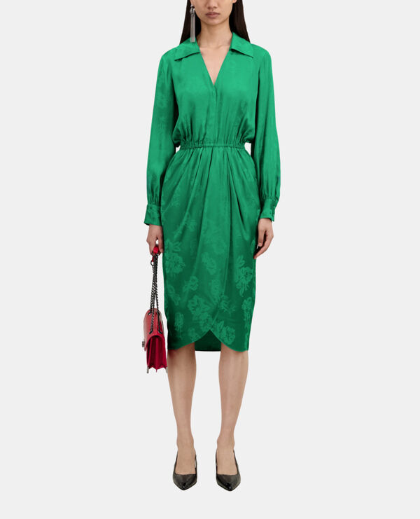 mid-length green dress with flowers