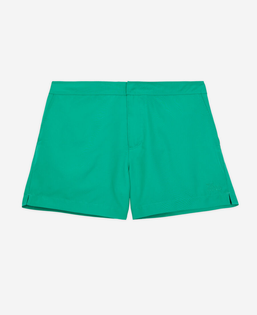 green swim shorts with logo