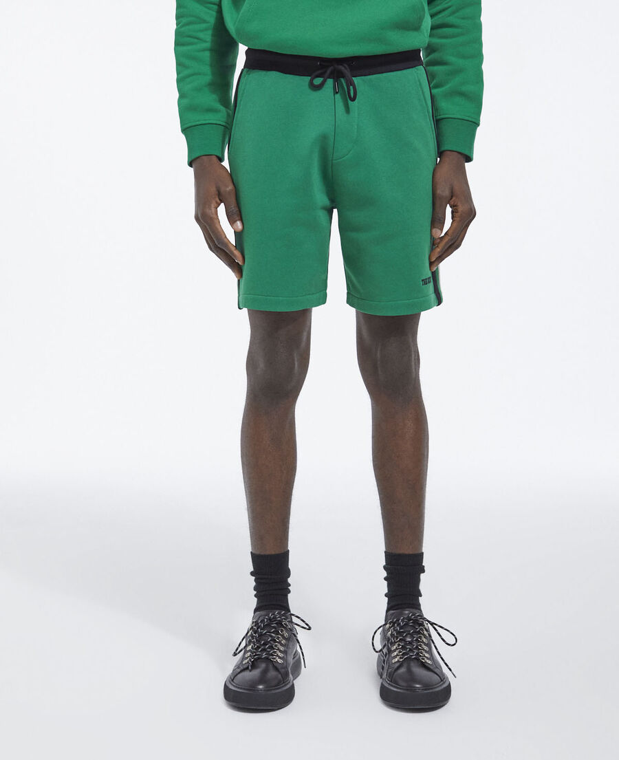 green fleece shorts with black side stripes