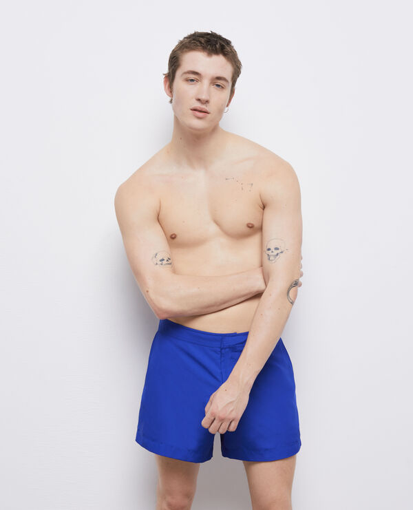 blue swim shorts with logo