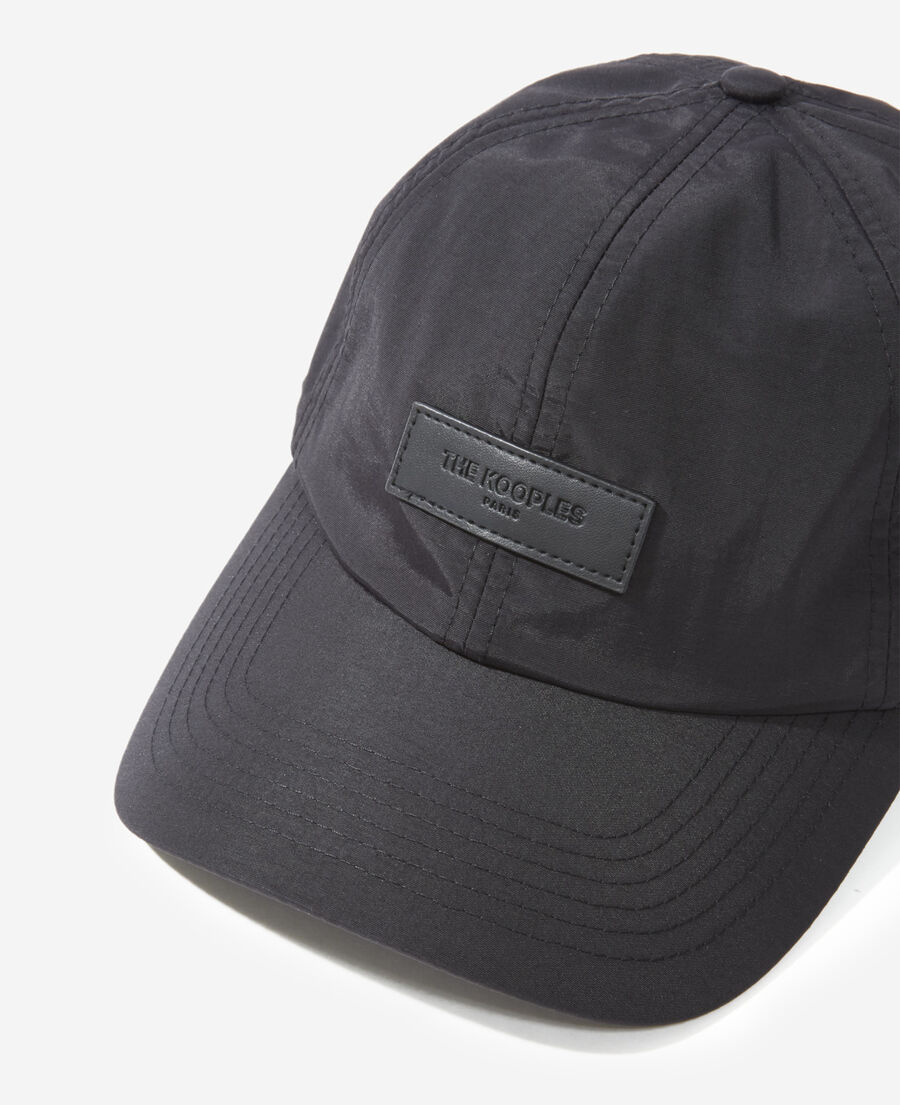 black nylon cap with matching leather badge