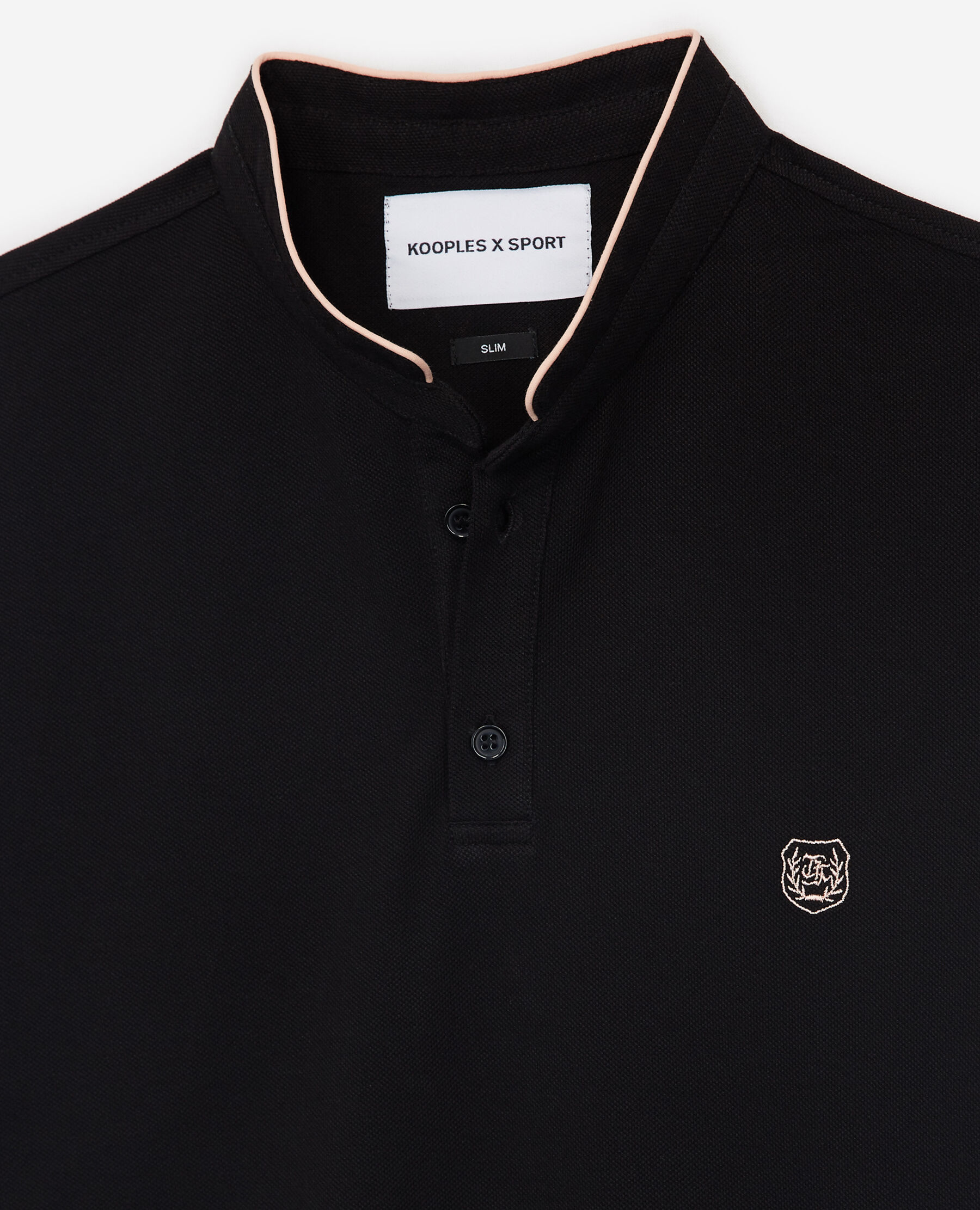 Black polo with coral pink details