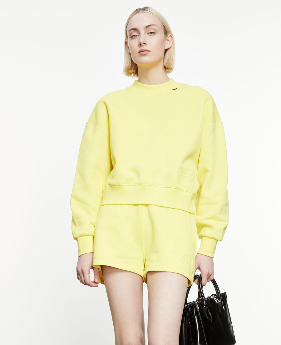 yellow sweatshirt with embossed logo